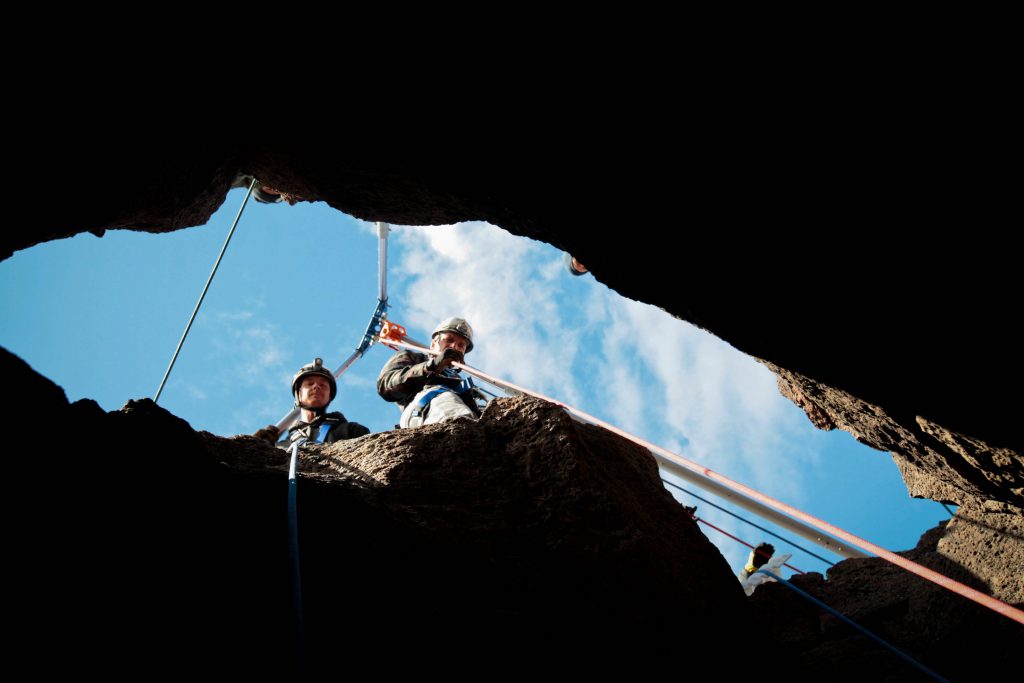 Essential equipment and techniques for confined space rescue including mechanical advantage, air quality, lighting, and safety.